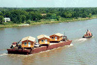 Houses moved on river barge